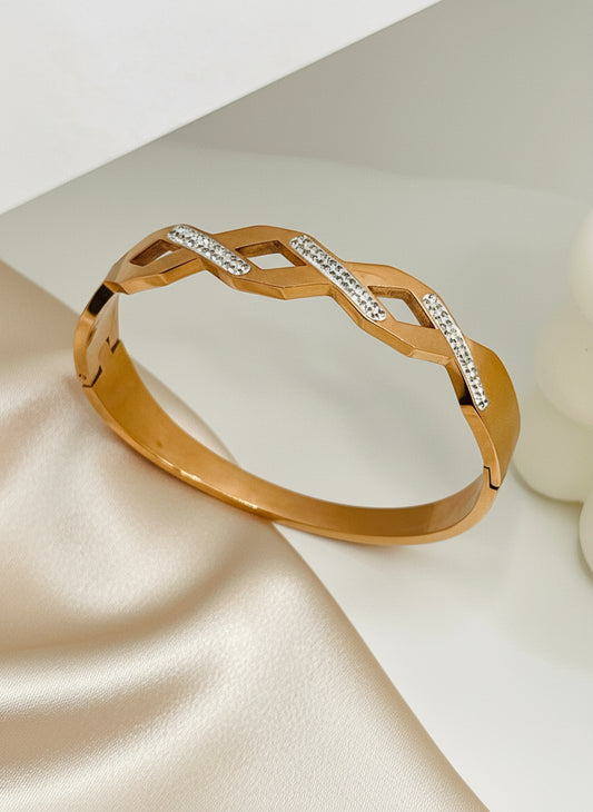 Rose Gold bracelet with diamond accents on a light background