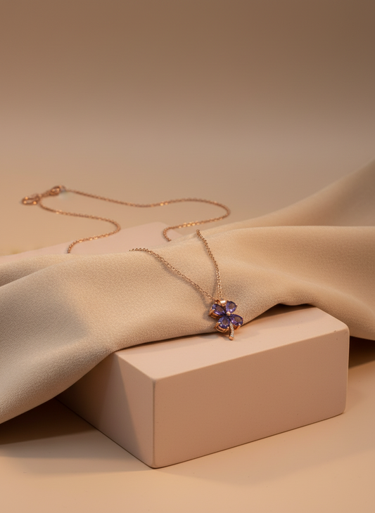 Necklace with a purple pendant on a mannequin bust against a white background