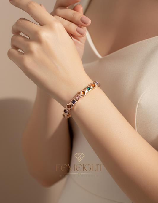 Bracelet on a wrist with a soft background, featuring the brand 'FEMEIGITI'.