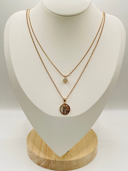 Double layer Rose Gold necklaces on a mannequin bust with a white background