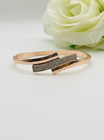 anti tarnish Rose gold bracelet with diamond accents on a white background