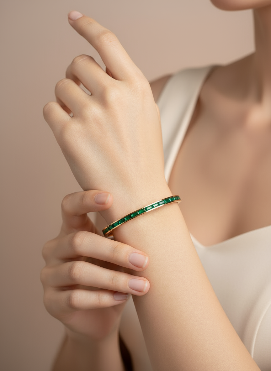Person wearing a  Rose gold green stone bracelet/bangle on a neutral background
