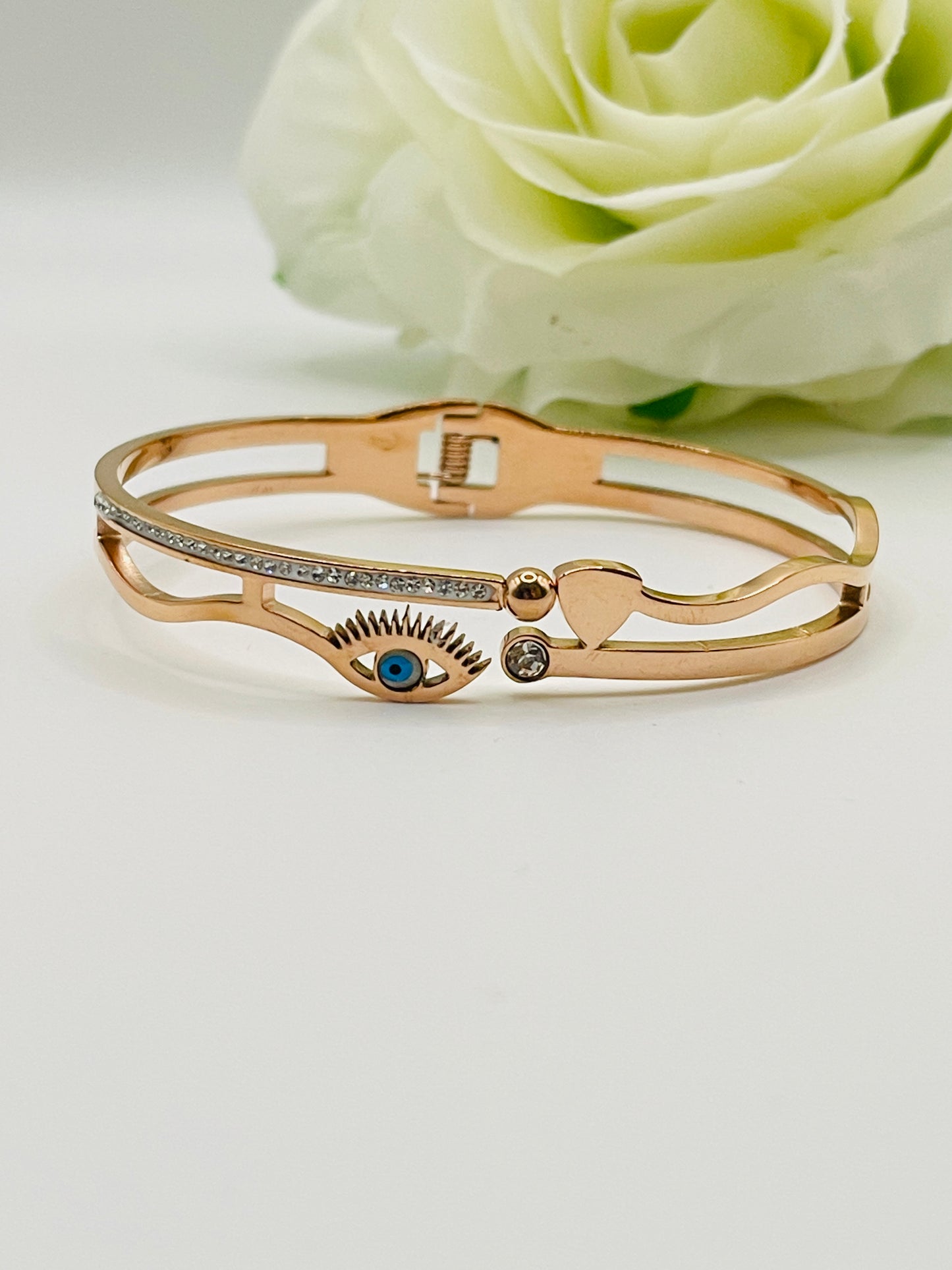Rose Gold bracelet with decorative elements on a light background