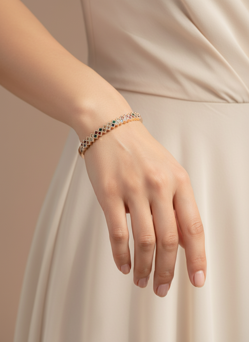 Hand wearing a bracelet on a beige background