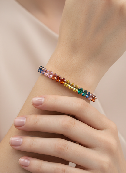Multicolored beaded bracelet on a wrist with a soft background