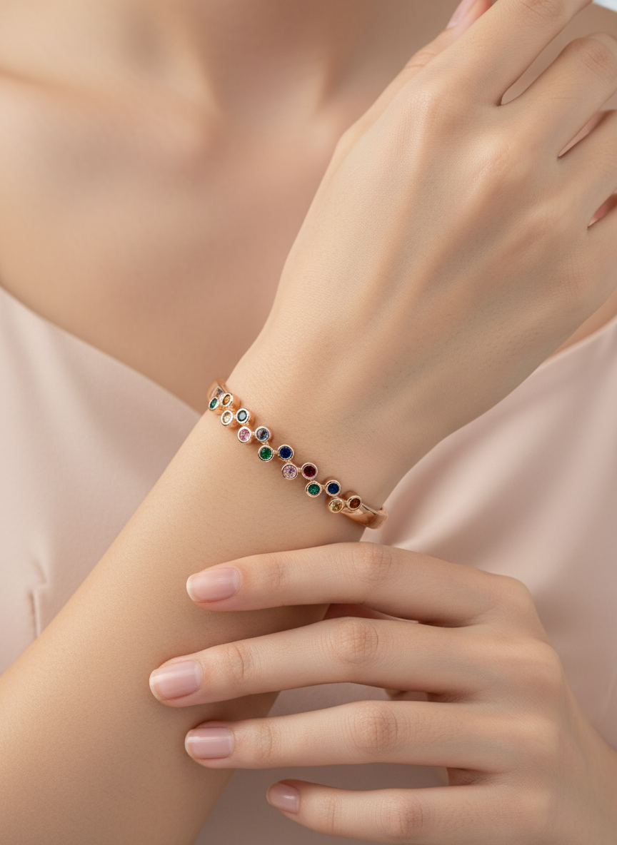 Close-up of a hand wearing a colorful bracelet on a light background