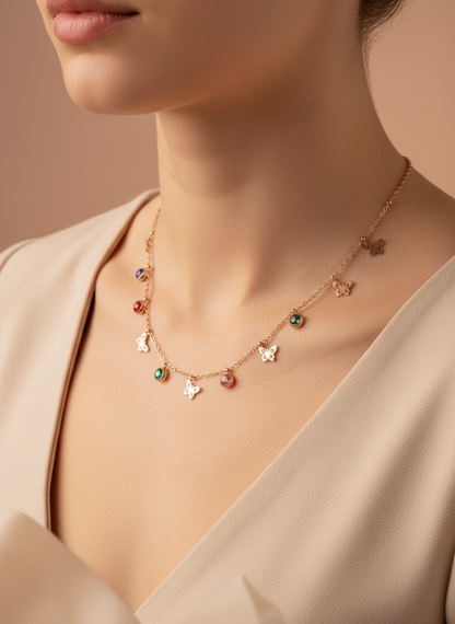 Necklace with colorful charms on a mannequin bust, accompanied by a ring on a small stand.