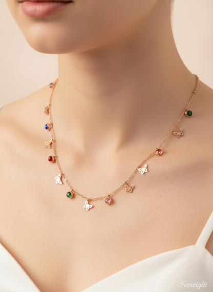 Necklace with colorful charms on a mannequin bust.