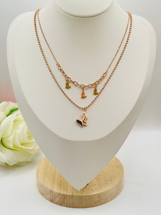 Necklace with butterfly-shaped pendant on a mannequin bust with a white background