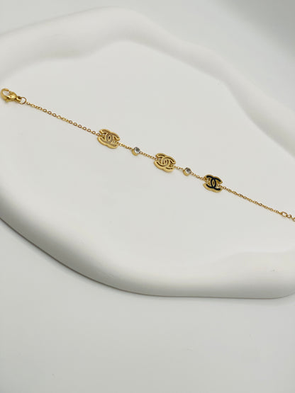 Gold bracelet with chain design on a white background
