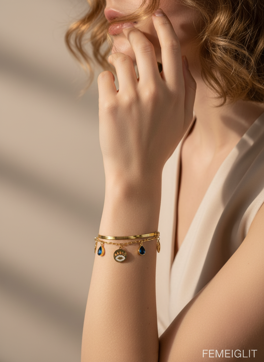 Gold bracelet with blue stones on a white background