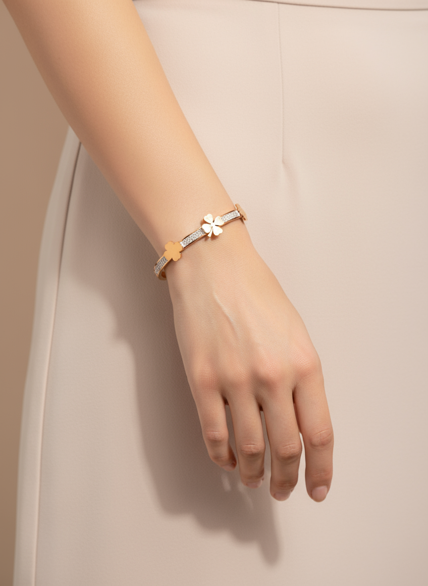 Hand wearing a bracelet with a neutral background