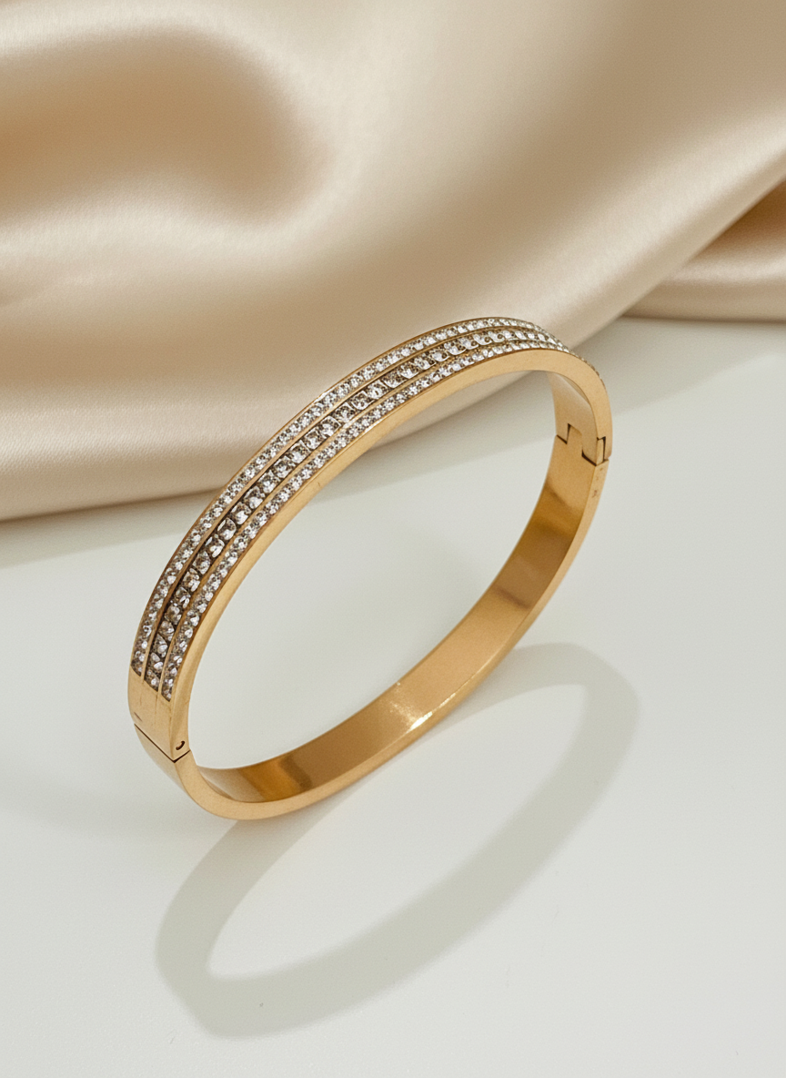 Rose Gold bracelet with diamond accents on a satin surface