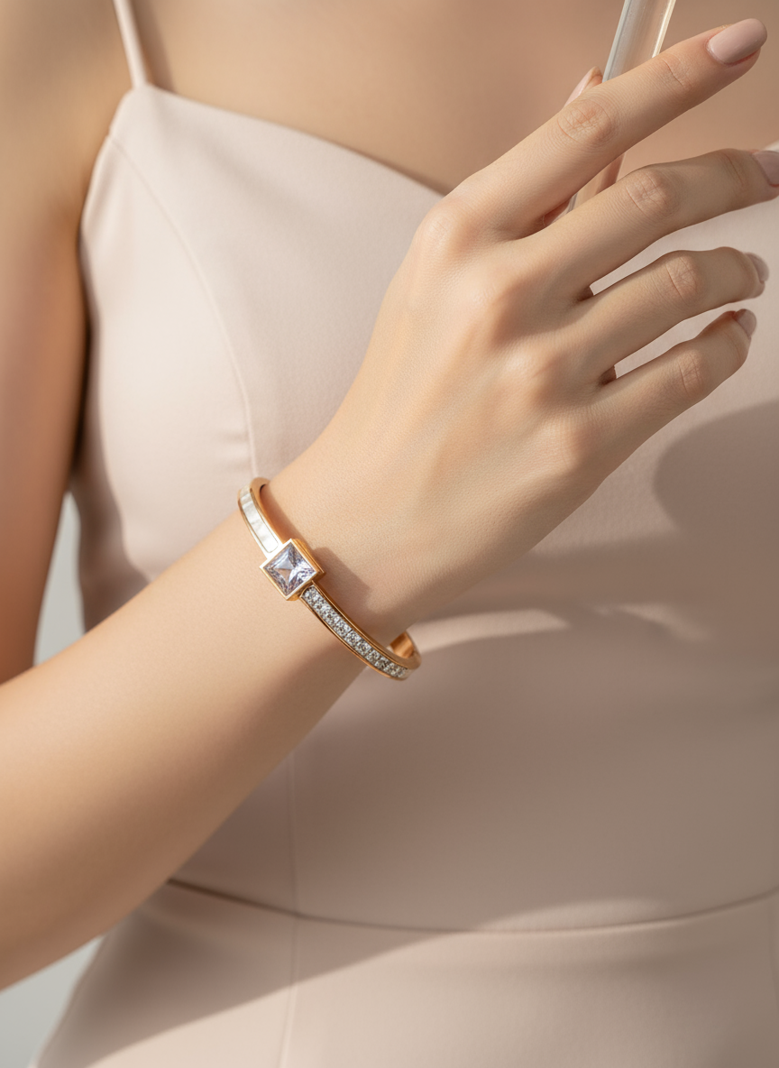 Close-up of a hand wearing a bracelet with a neutral background