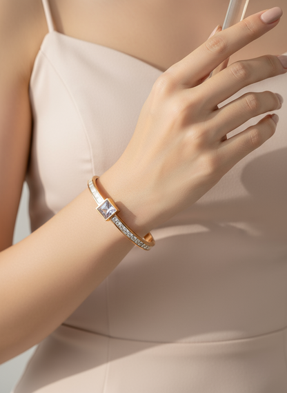 Close-up of a hand wearing a bracelet with a neutral background