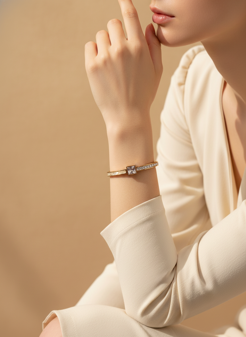Close-up of a person wearing a bracelet on a beige background