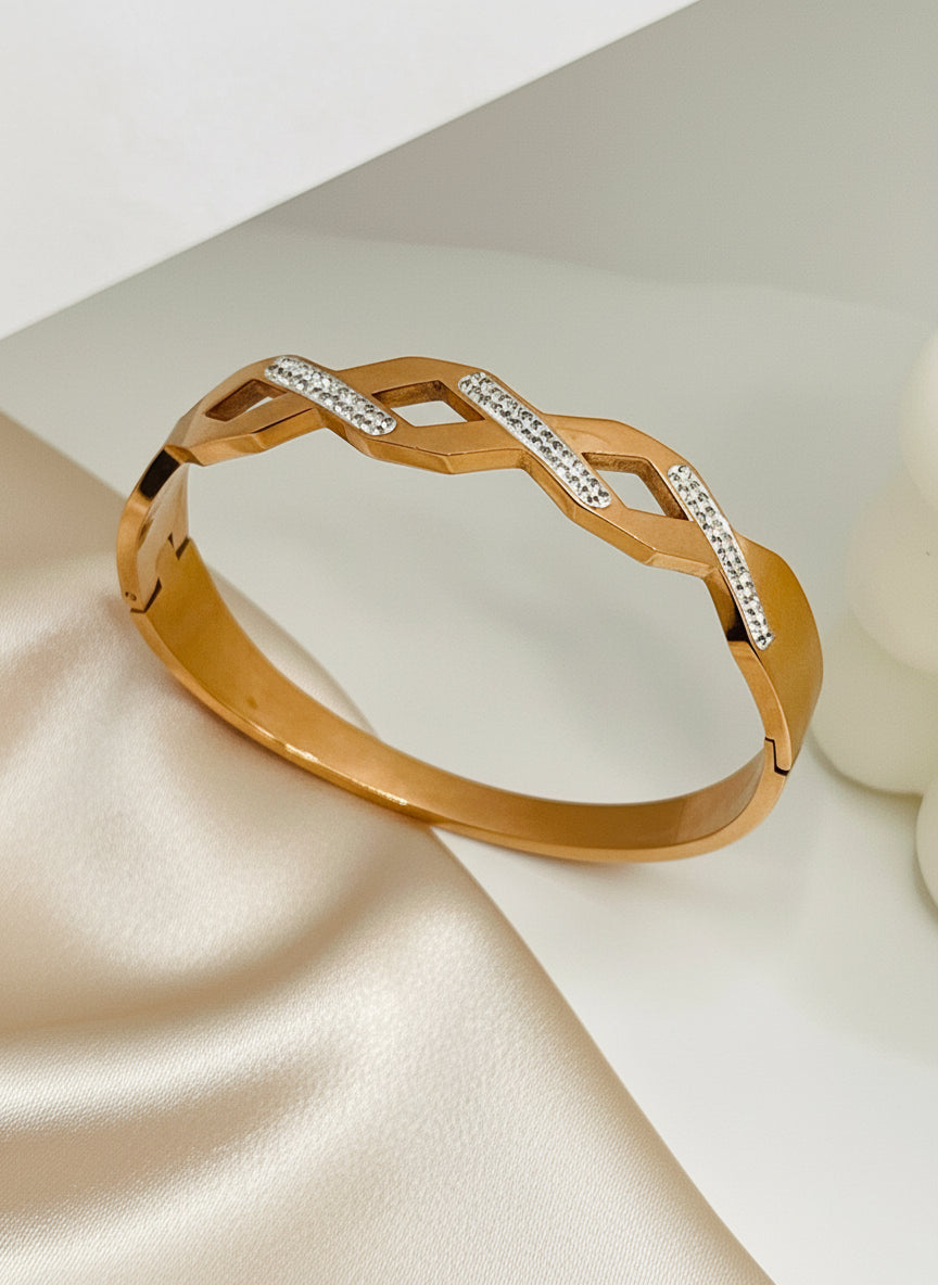 Rose Gold bracelet with diamond accents on a light background