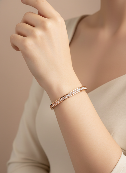 Rose Gold bangle with clear stones on a white background