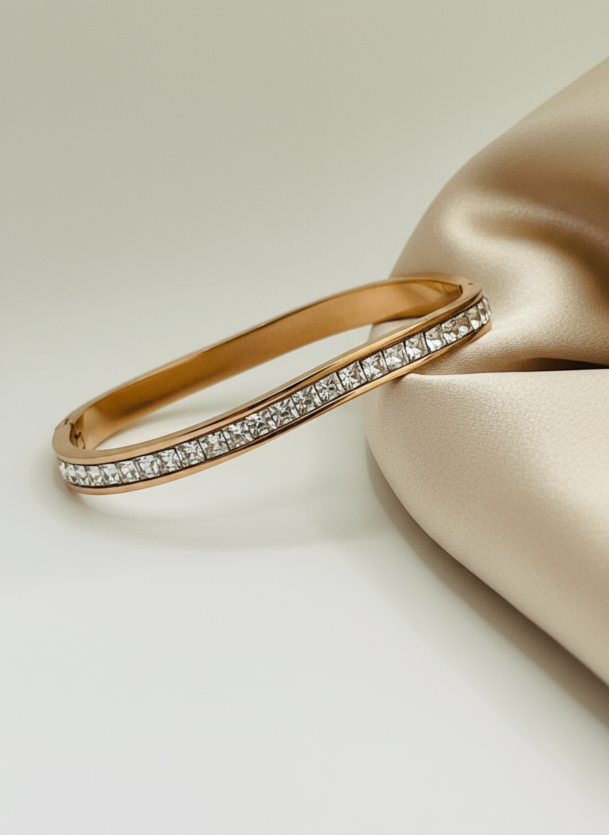 RoseGold bracelet with diamond accents on a beige surface