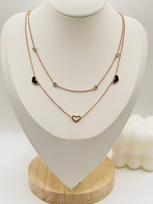 double layer necklaces on a white mannequin bust with a wooden base.