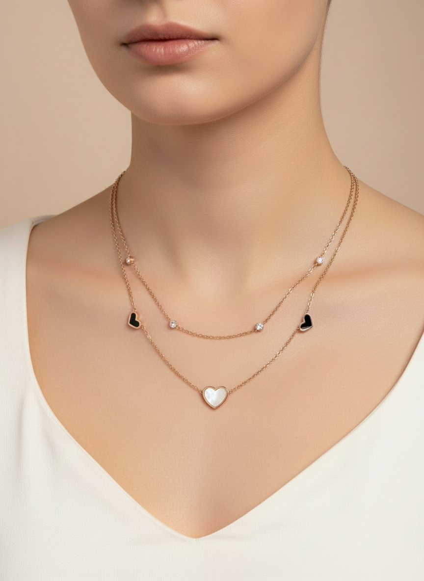 Necklace with heart pendants on a neutral background