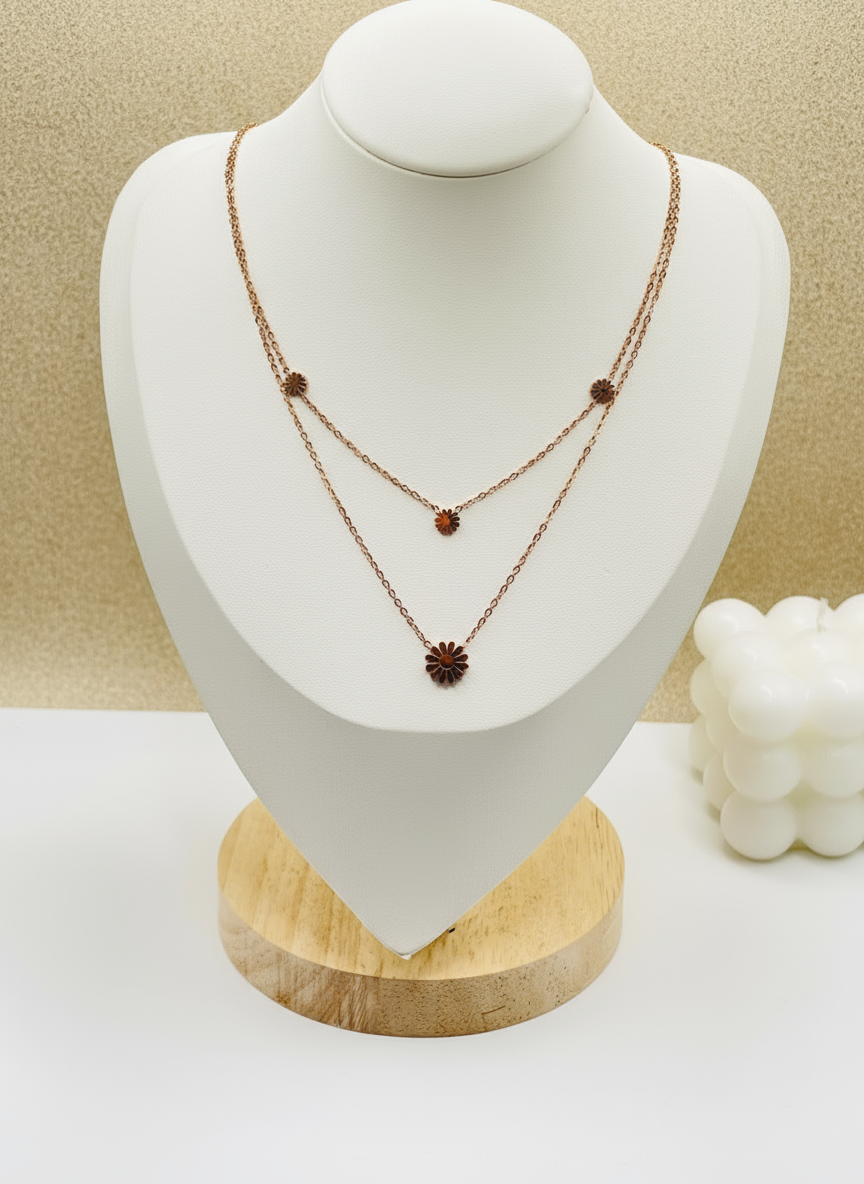 Necklace on a white mannequin bust with a beige background