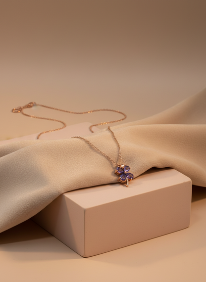 Necklace with a purple pendant on a mannequin bust against a white background