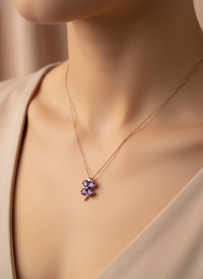 Necklace with a purple pendant on a mannequin bust against a white background