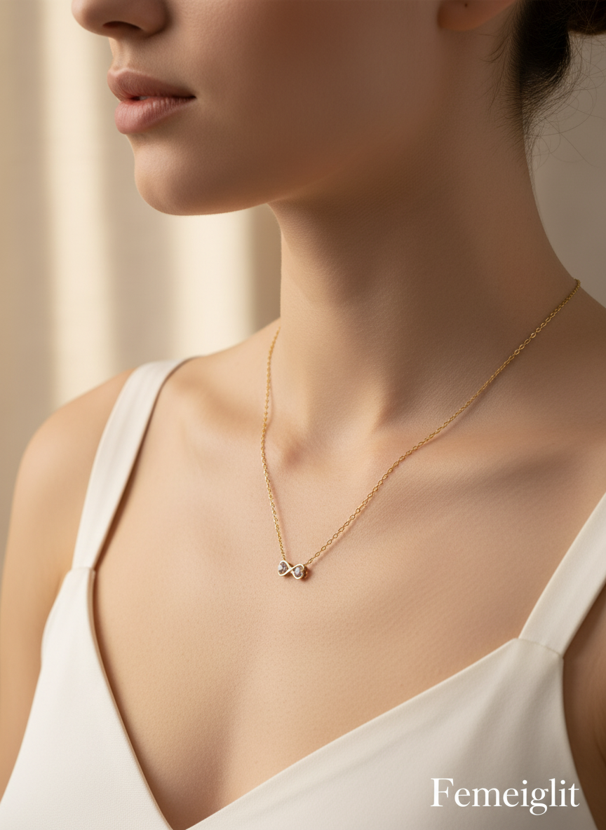 Necklace with a small pendant worn by a model, brand 'Femeiglit' visible