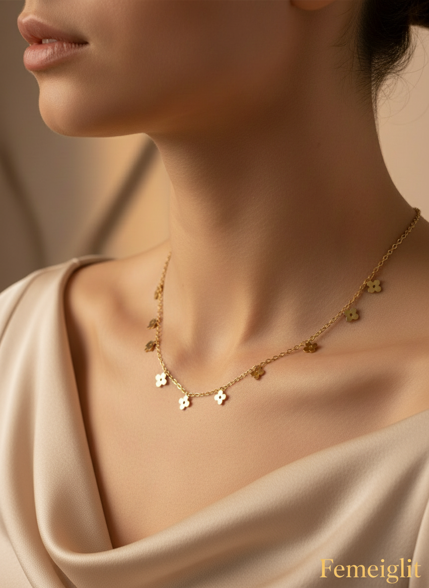 Gold necklace on a model with a neutral background