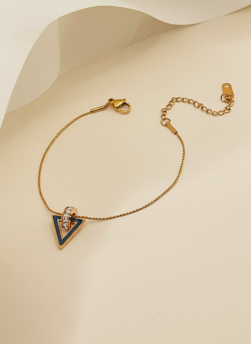 Rose Gold bracelet with a triangle pendant on a white background
