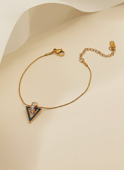 Rose Gold bracelet with a triangle pendant on a white background