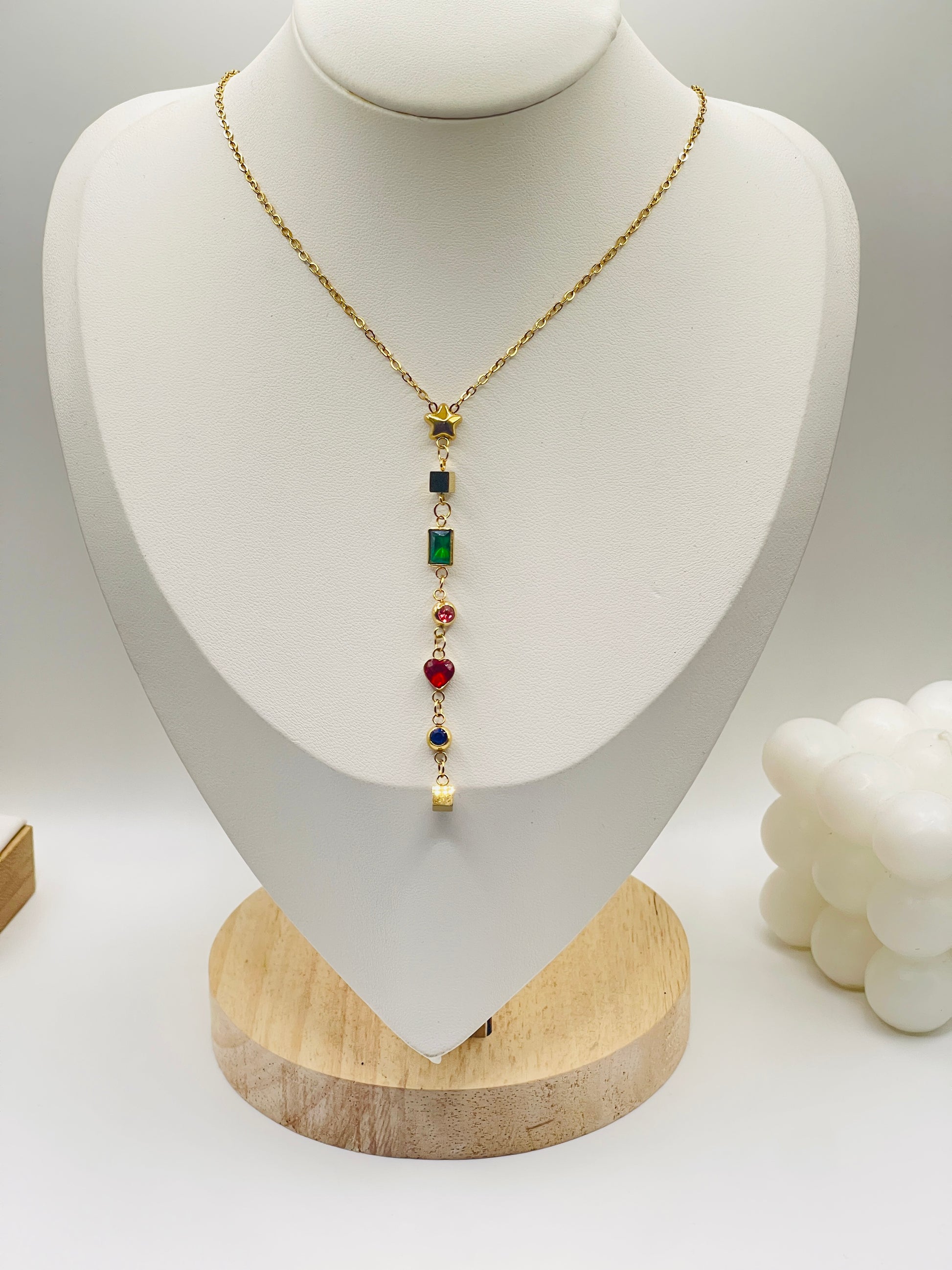 Necklace with colored beads on a white bust