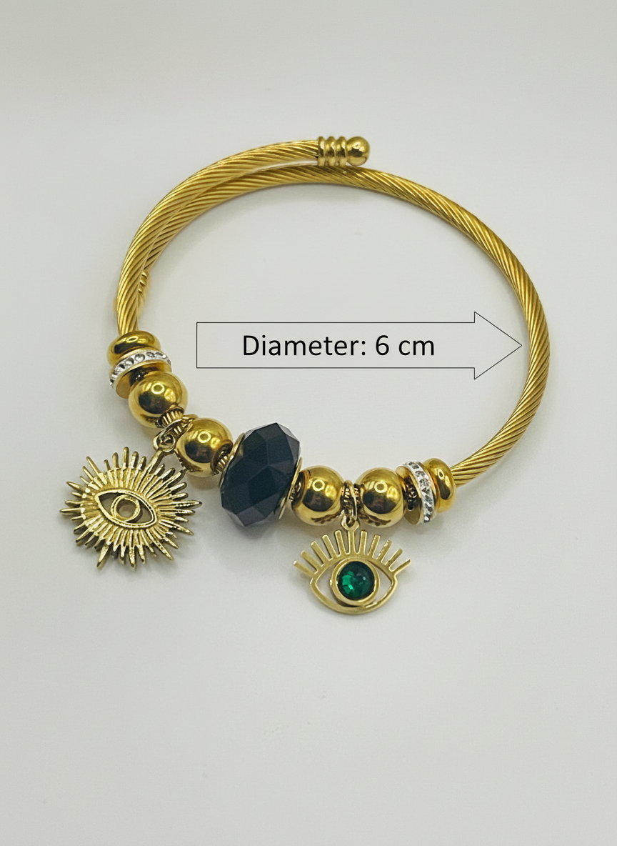 Gold bracelet with charms on a white background
