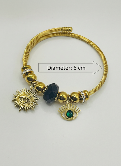 Gold bracelet with charms on a white background