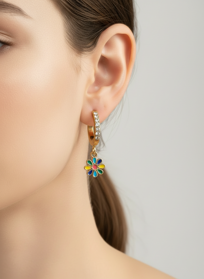 Close-up of a colorful flower earring on an ear with a neutral background