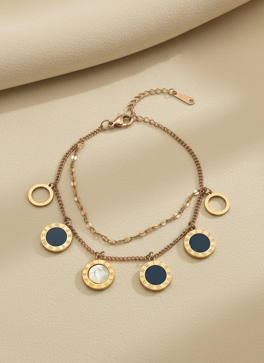 Rose Gold bracelet with circular charms on a beige background