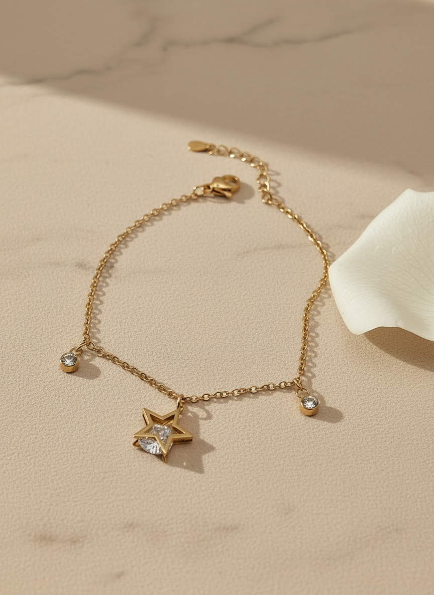 rose Gold bracelet with star and heart charms on a beige surface