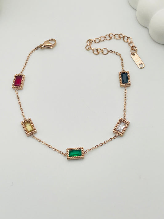 Bracelet with gemstone accents on a white background