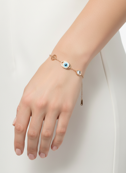 bracelet with eye-shaped pendant on a white textured surface