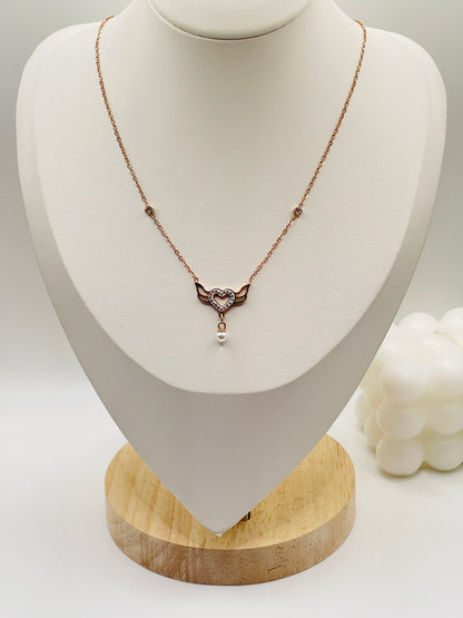 Rose gold Necklace with a heart-shaped pendant on a mannequin bust