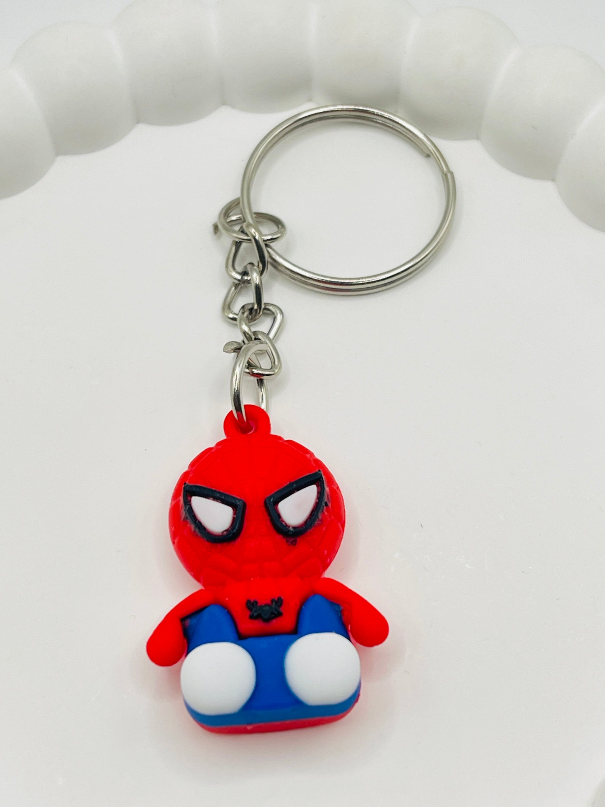 Spider-Man keychain on a white background