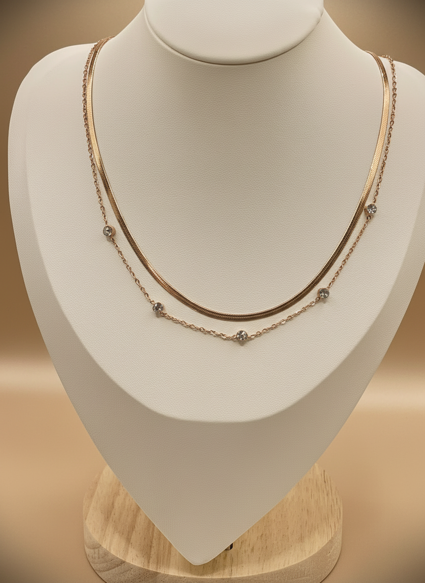 Necklace on a mannequin bust with a beige background