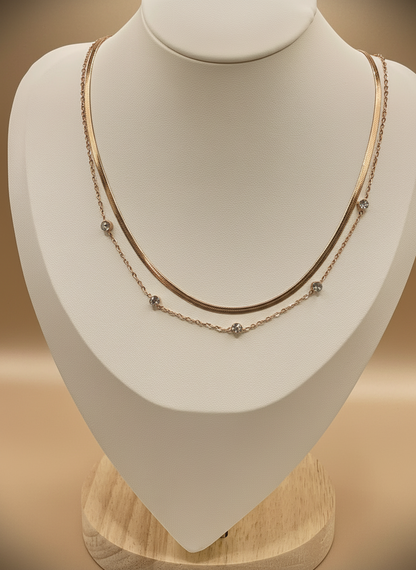 Necklace on a mannequin bust with a beige background