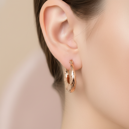 Gold hoop earrings on a white background